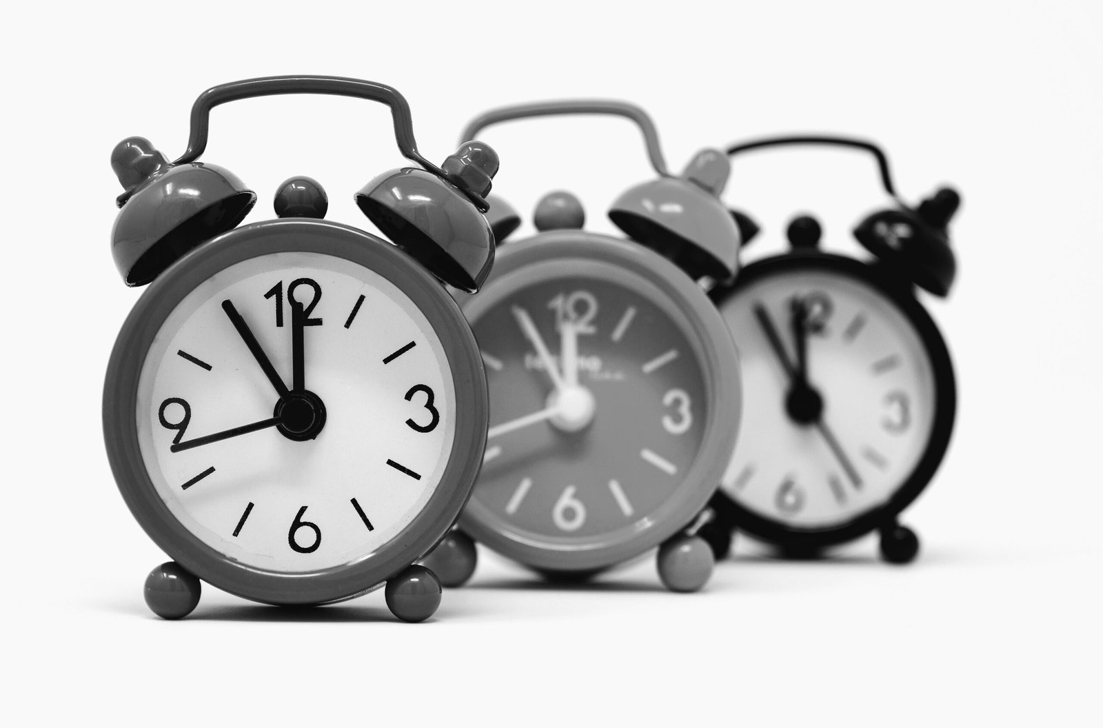 Alarm clocks symbolizing time management skills and master your time concept