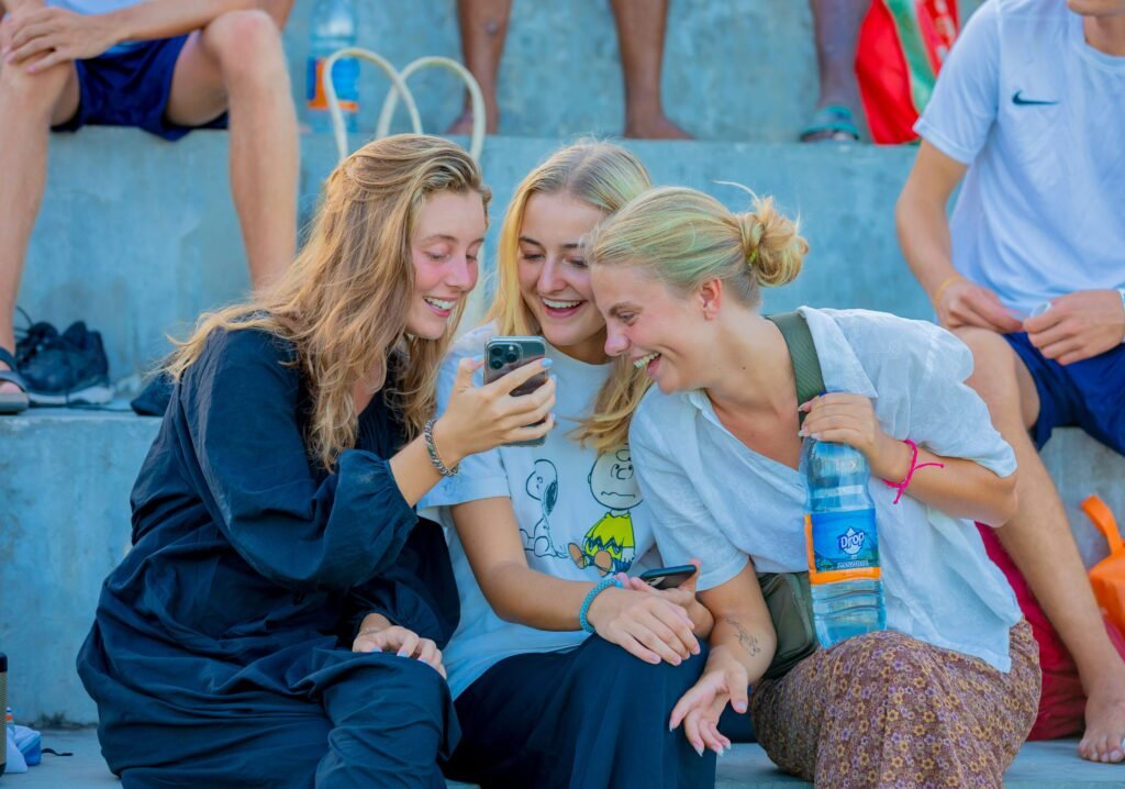 Friends laughing together representing genuine connection and social health