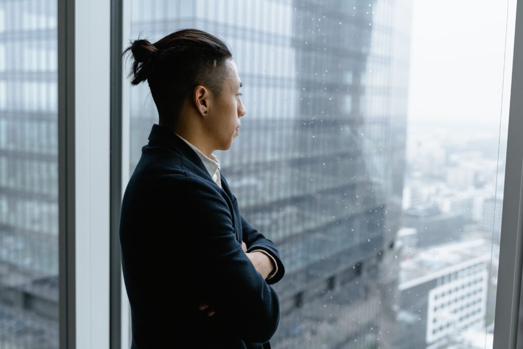 Professional reflecting on modern life challenges