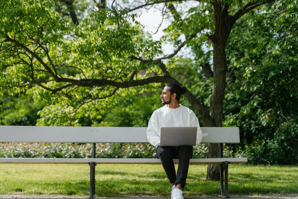 Man working alone outdoors symbolizing isolation from remote work culture