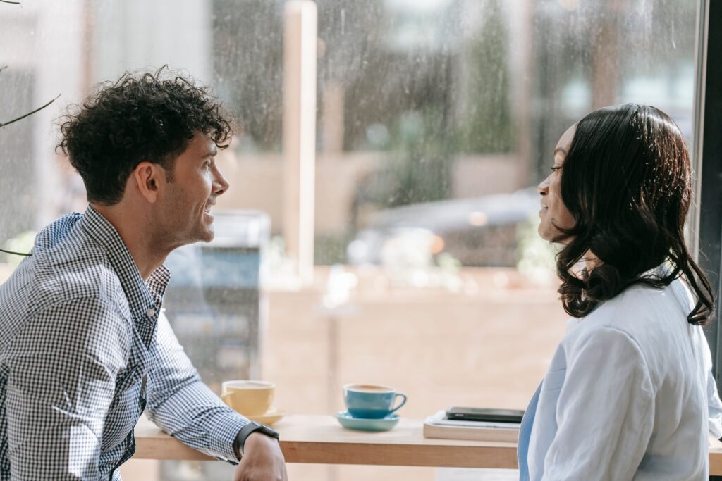 Man and woman having a warm, open conversation, expressing themselves honestly without suppressing feelings