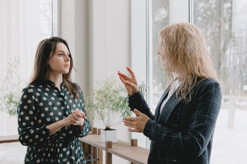 actively listening while colleague explains something, demonstrating good communication skills