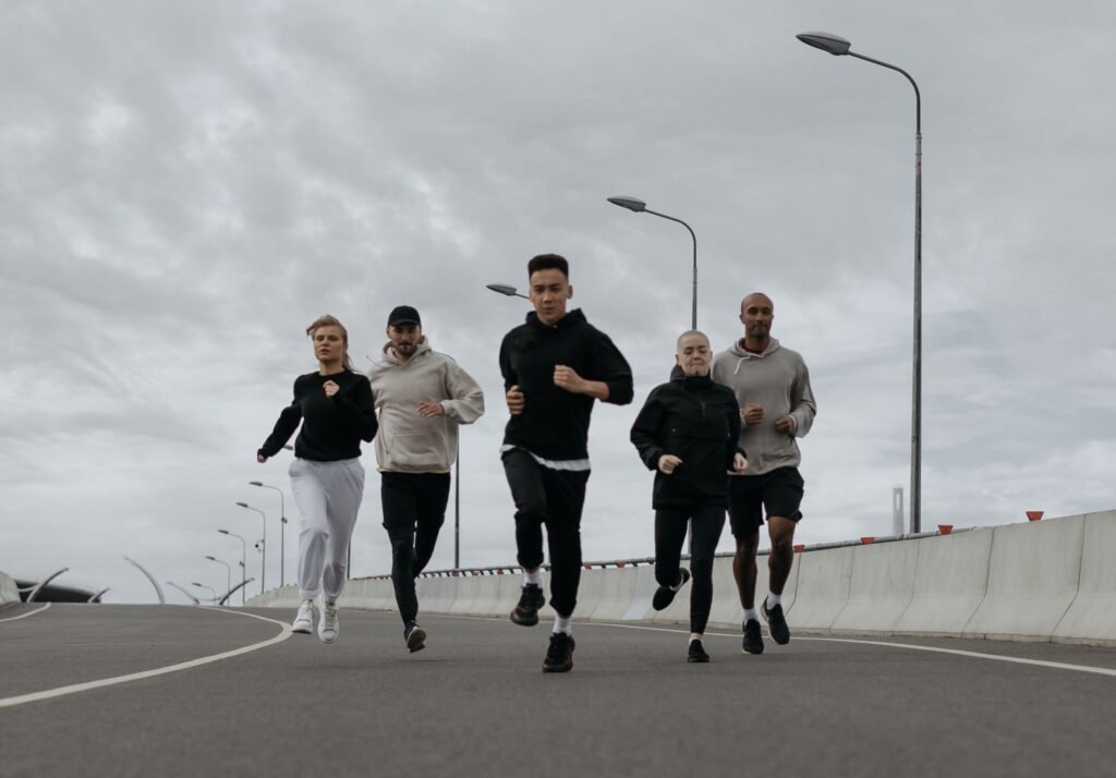 Group of friends running together outdoors as part of a morning run club
