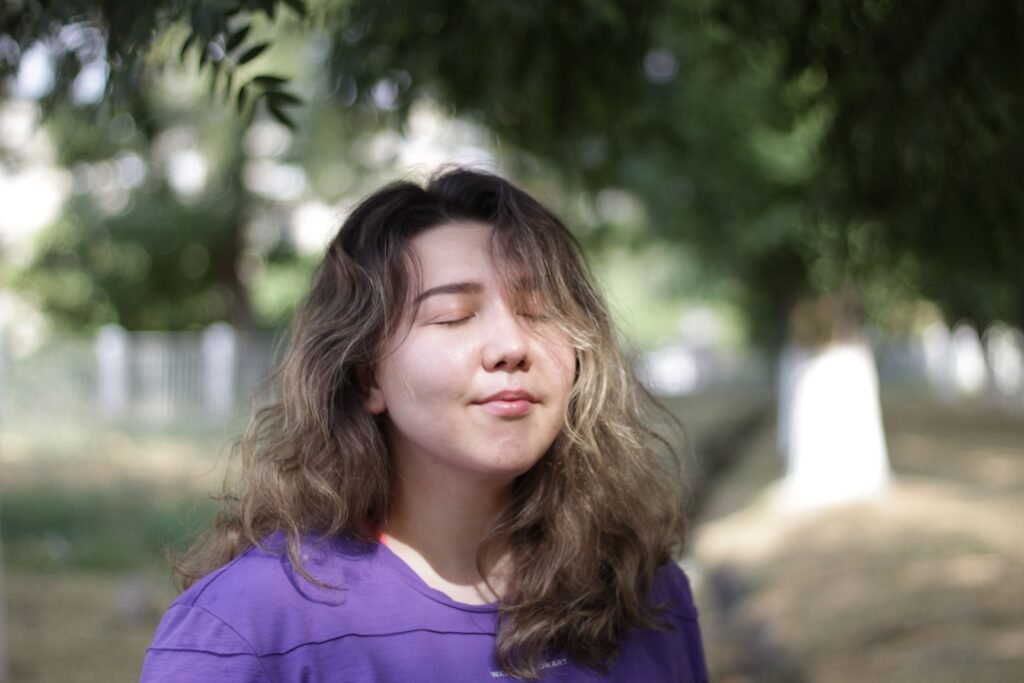 Woman feeling calm and at peace outdoors, symbolizing hope in mental health
