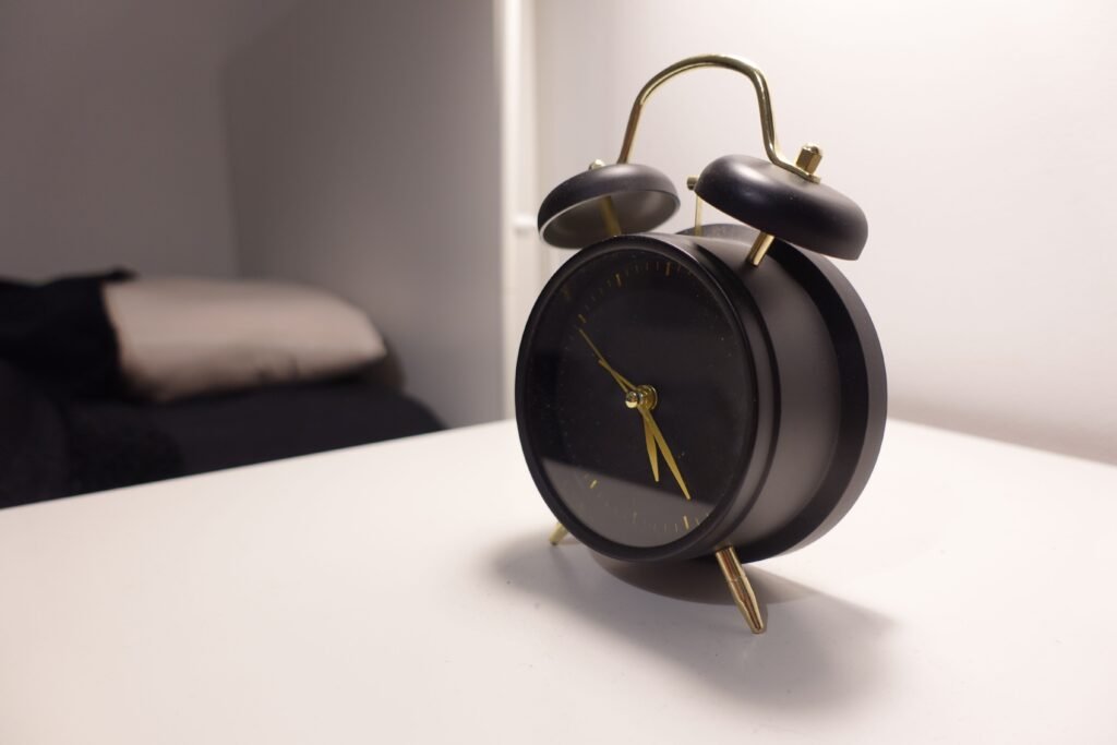 Alarm clock representing sleep duration and biological aging research