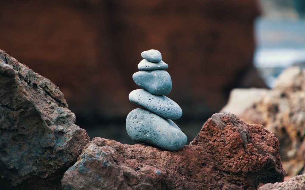 Balanced stack of stones, symbolizing the brain's reward system rewiring after breaking the scrolling habit