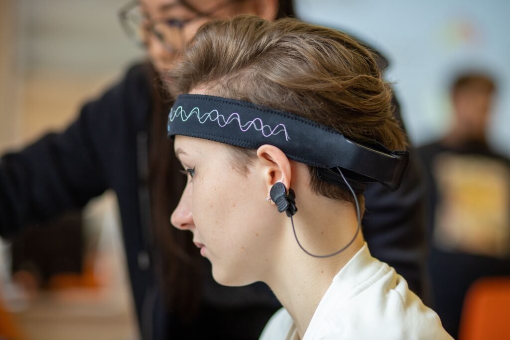 Research participant wearing EEG headband for sleep deprivation study
